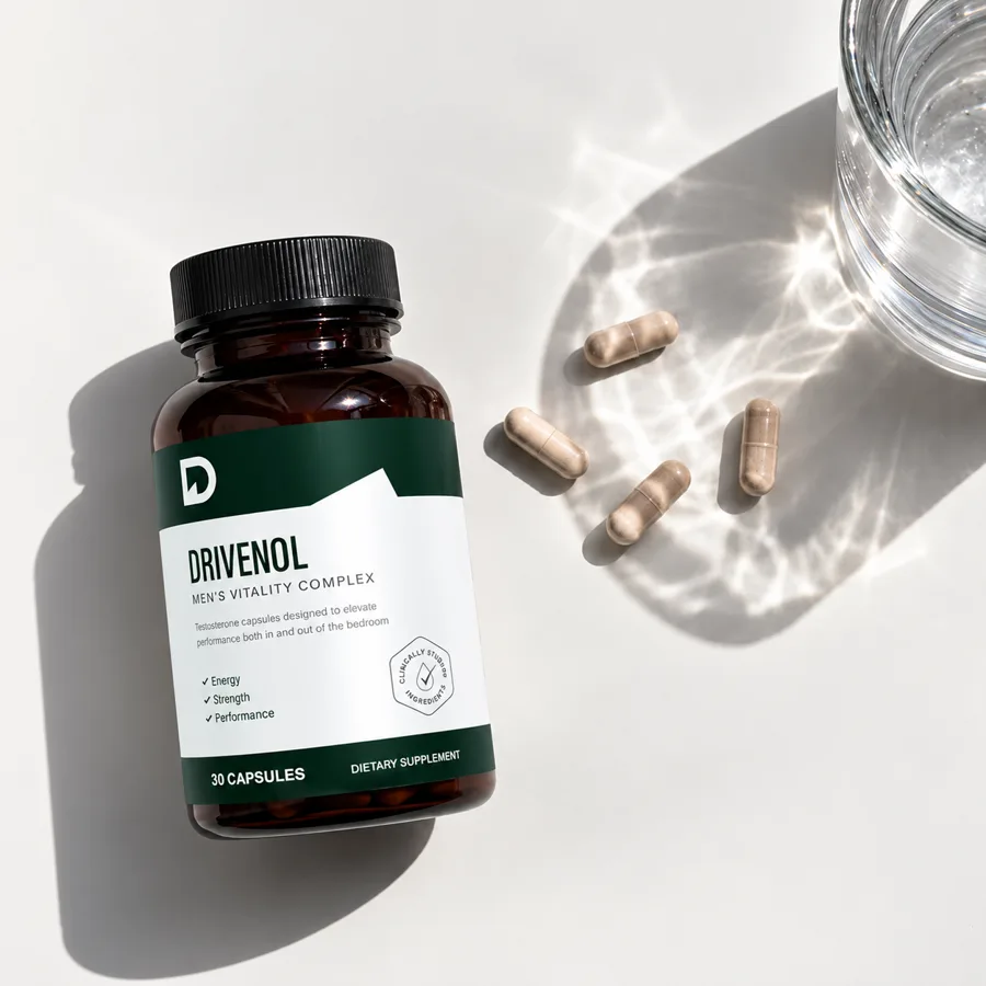 Drivenol capsules next to a glass of water